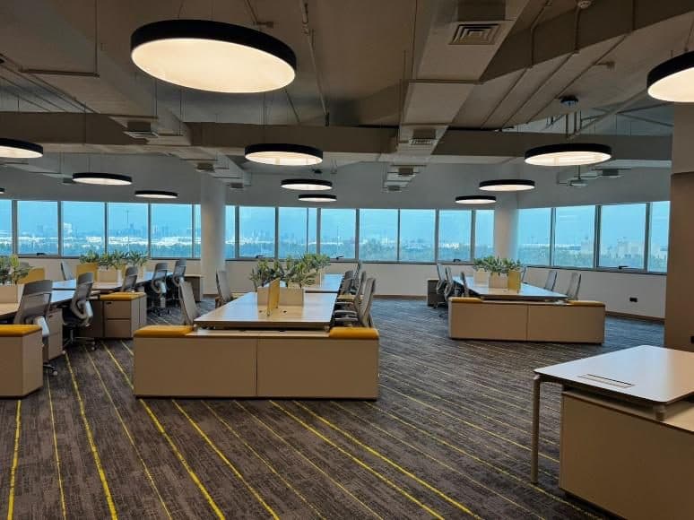 Schneider Electric Abu Dhabi office — workstations with panoramic city views
